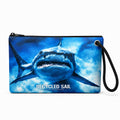 Recycled Sail Shark wristlet made from recycled sail with zipper and black rope loop