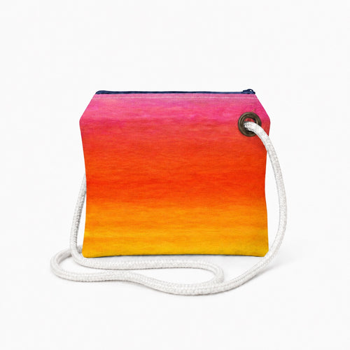 Sunset crossbody recycled sail bag with zipper closure